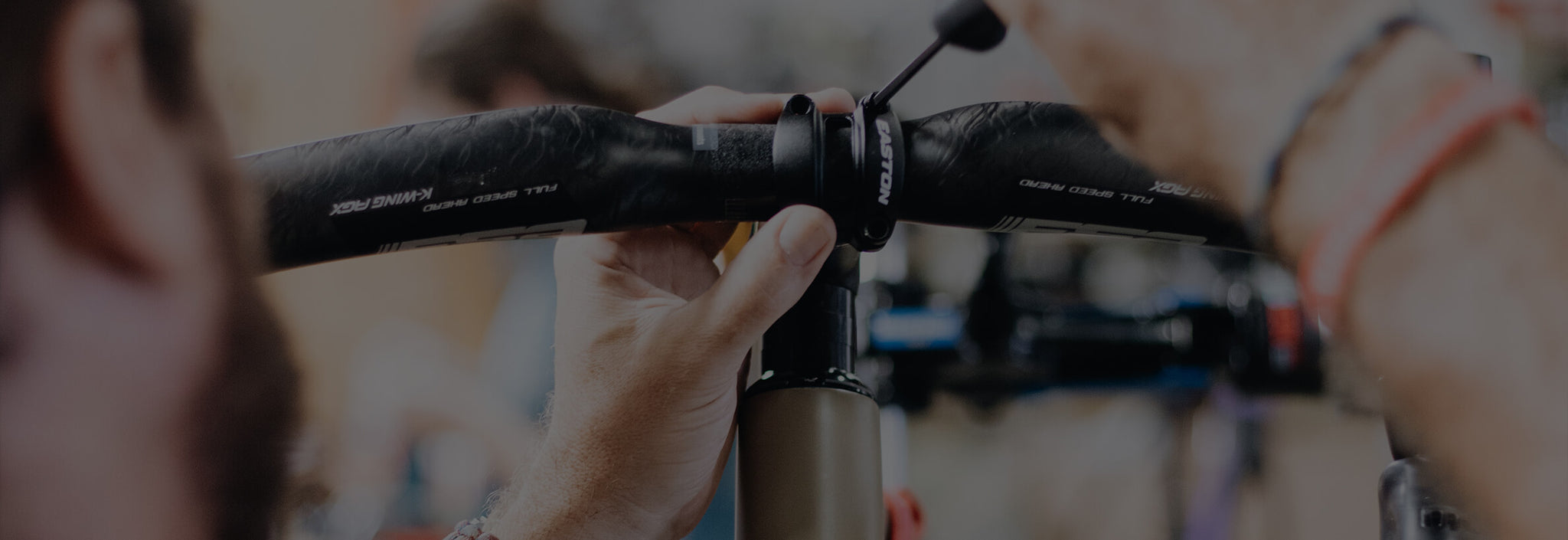 Close up of bike builder torquing handle bars