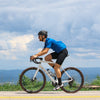 Cyclist riding OBED RVR endurance bike on a high ridge	