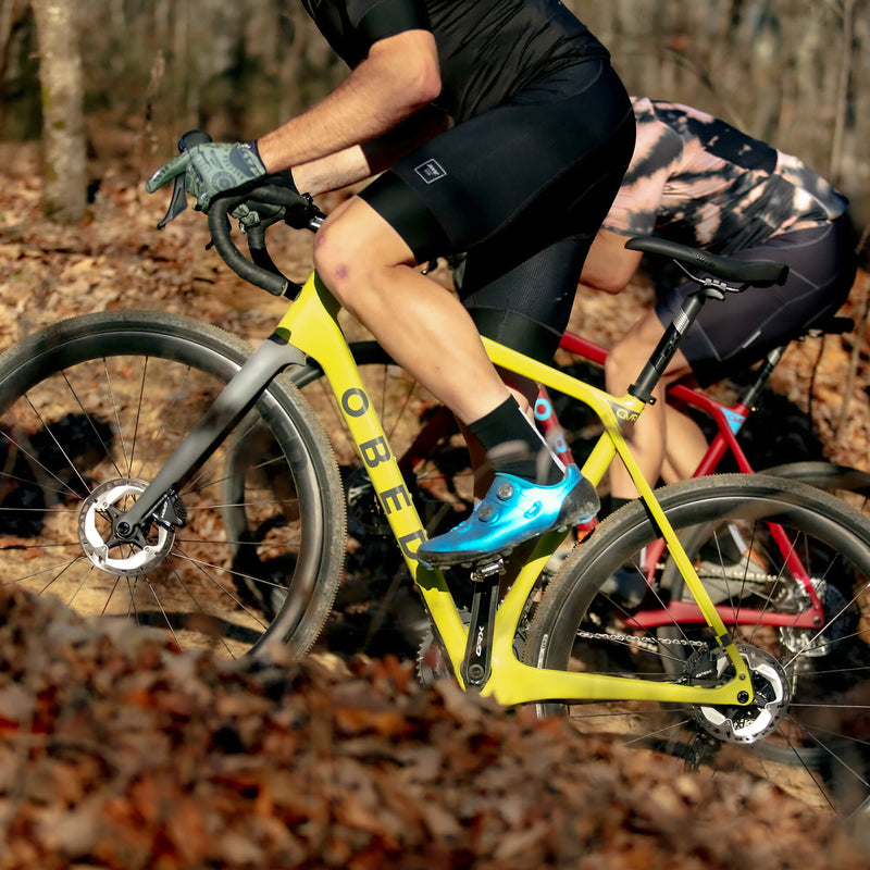 Two GVR riders climbing up a gravel trail