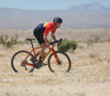 Man riding orange Obed Boundary across desert